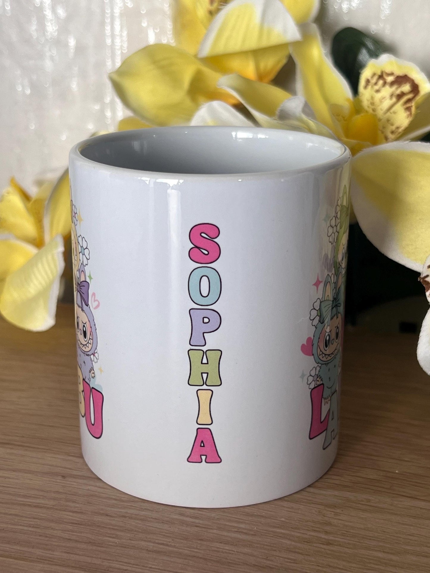 Labubu inspired mug. labubu cup personalised with name. printed both sides 10oz mug. Childs cup now with matching aluminium water bottle.