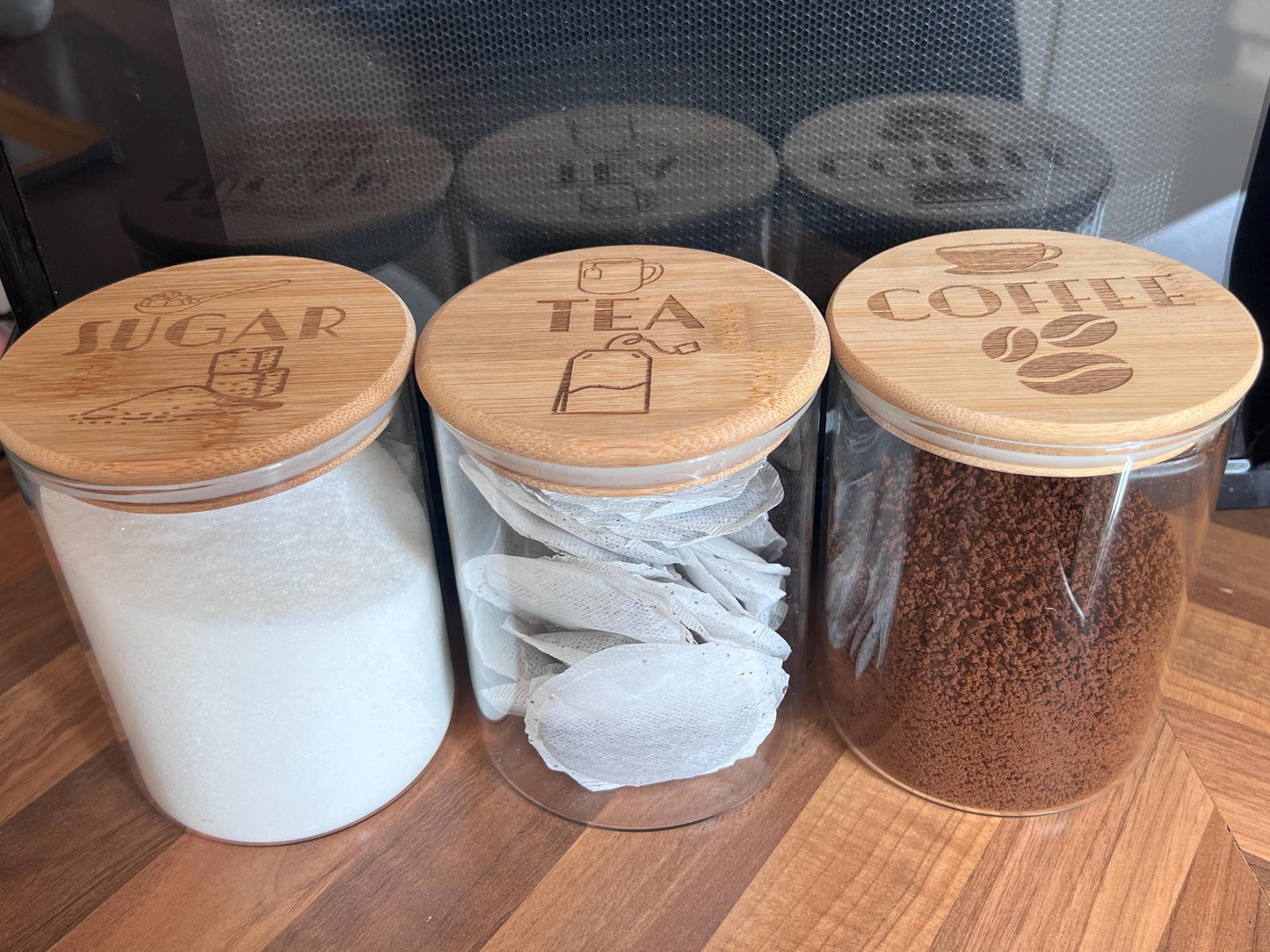 Engraved Tea Coffee and Sugar canister set or individual. Glass storage with engraved airtight bamboo lid. visual aid