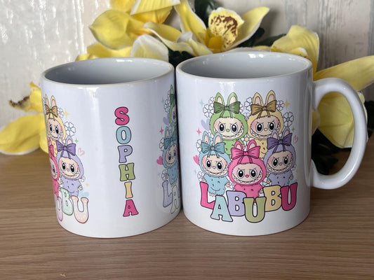 Labubu inspired mug. labubu cup personalised with name. printed both sides 10oz mug. Childs cup now with matching aluminium water bottle.