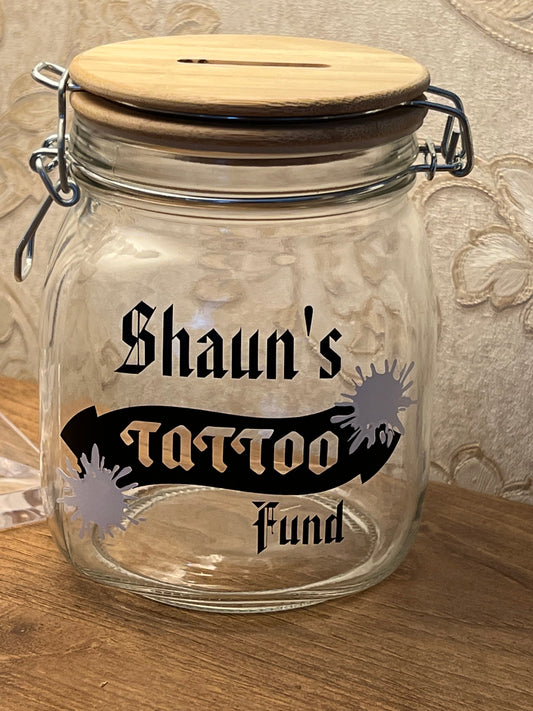 Personalised Tattoo glass money jar. Savings jar. 2 sizes ….Money jar, coins and notes.